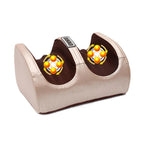 Gold foot massager with orange massage balls on a white background