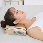 Woman using a neck massager on a bed