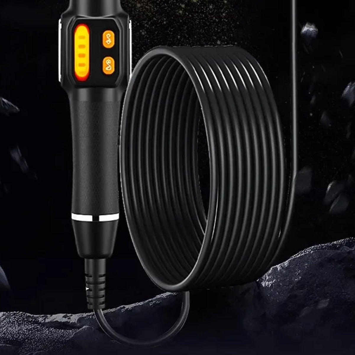 Detail of the inspection camera steering handgrip and coiled probe cable.