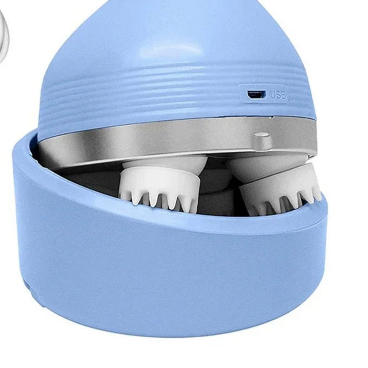 Close-up of the rotating massage heads, silver trim and matching blue storage base.