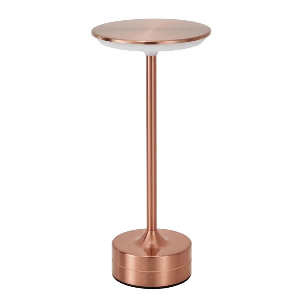 Rechargeable cordless table lamp with rose-gold metal finish and a flat circular shade on white
