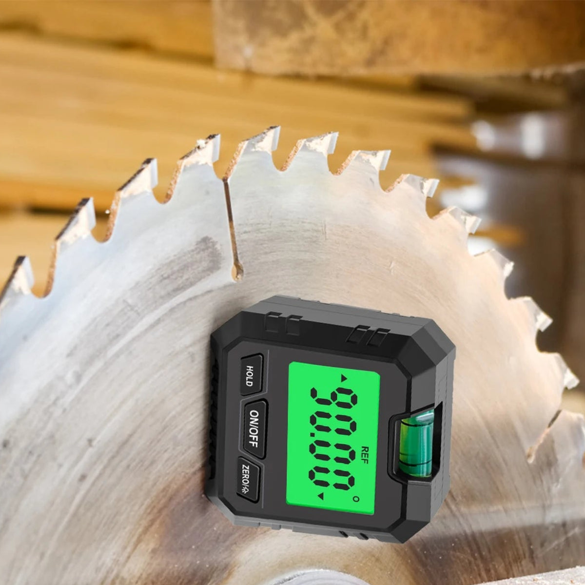 Digital angle gauge attached to a stationary saw blade to illustrate angle checking with the machine switched off