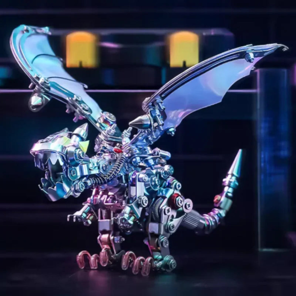 Completed metal dragon with raised iridescent wings photographed under coloured display lighting