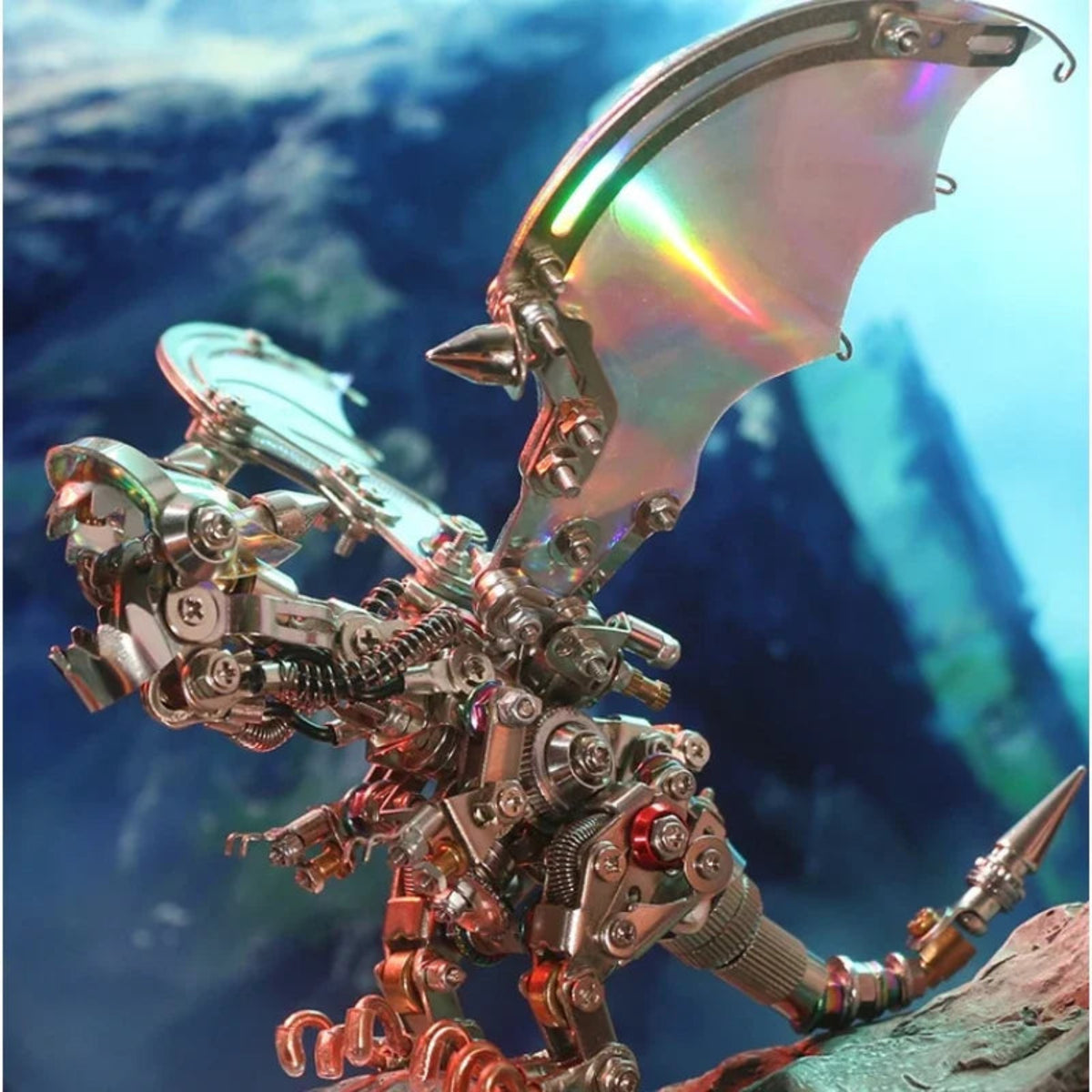 Angled view of the assembled mechanical dragon showing its head, metal wings and layered body