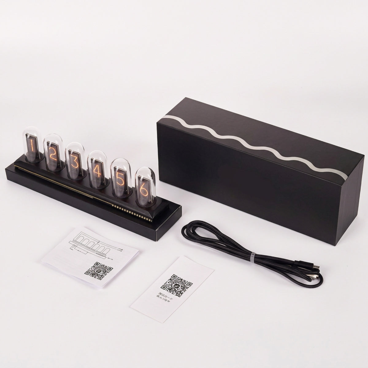 Six-screen IPS desk clock with its USB power cable, setup leaflets and packaging; a USB power adapter is not included