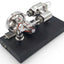 Polished Stirling engine generator on a white background with digital voltmeter and black display base