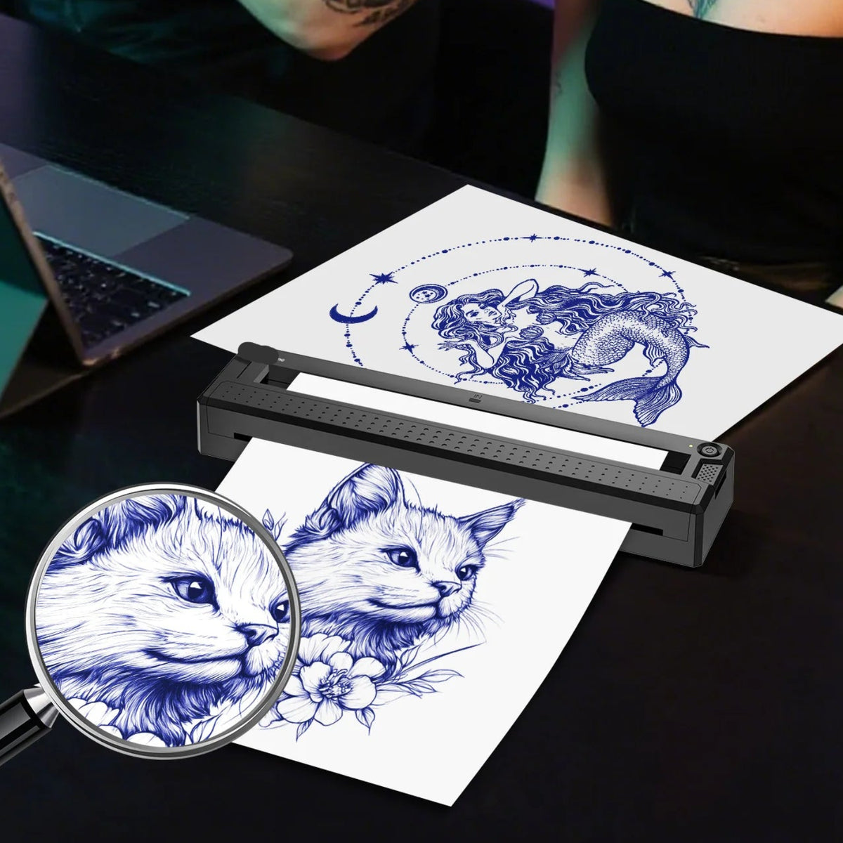 Black thermal stencil printer with illustrated tattoo linework and an enlarged print-detail example