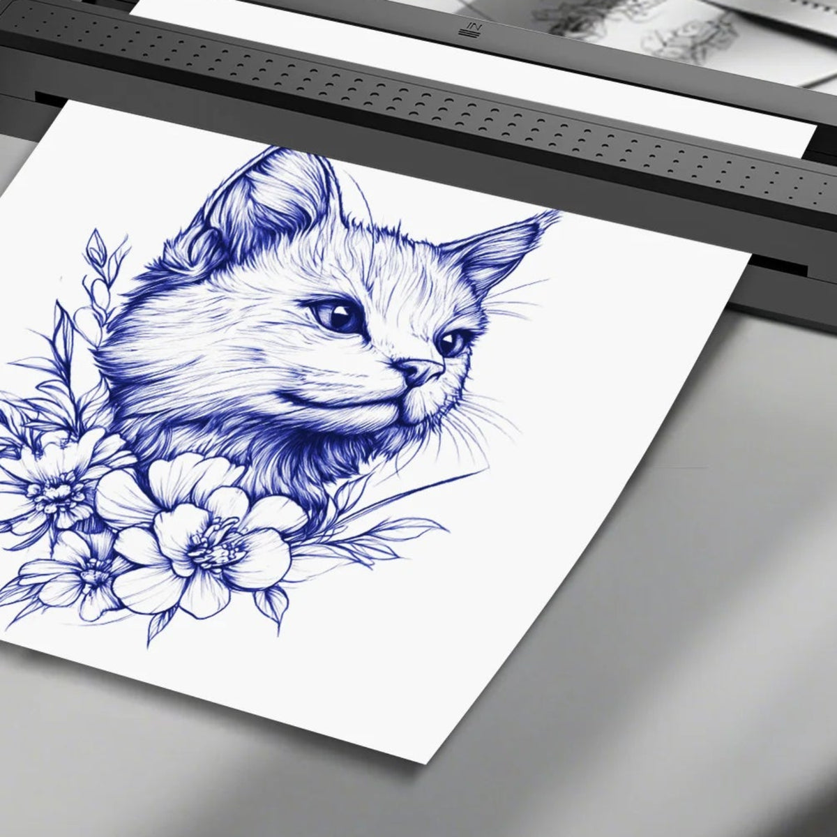 Close-up of the black thermal printer paper output with an illustrated cat-and-flower stencil design